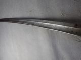 a close up of a metal spoon on a table