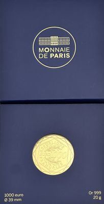 a close up of a gold coin in a blue box