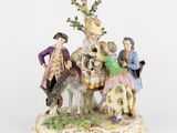 une image représentant une figurine représentant un groupe de personnes à cheval