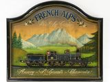 painting of a train on a wall with mountains in the background
