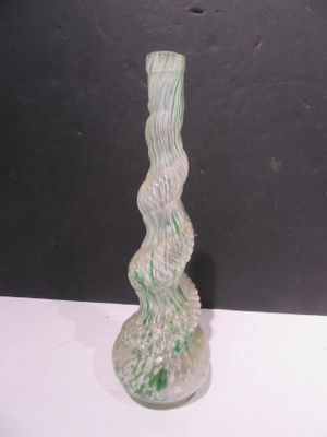 a glass vase that is sitting on a table