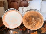 two vases that are sitting on a table