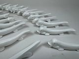a lot of white ceramic animals that are on the table