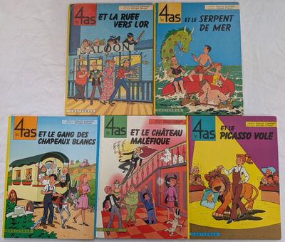 quatre livres pour enfants sont alignés sur une surface blanche