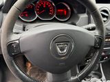 dashboard of a car with a steering wheel and dashboard gauges