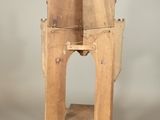 a small wooden table with a shelf on top of it