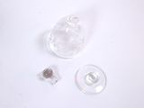a small piece of clear glass with a small hole in the middle of it