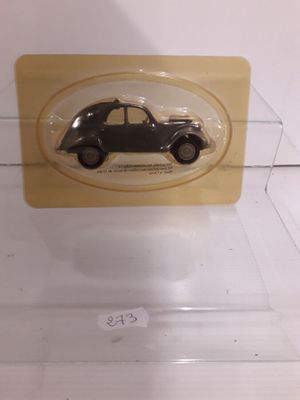 a small black car in a clear display case