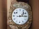 a clock that is in a box on the floor