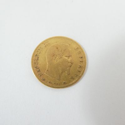 a gold coin with a picture of a woman on it