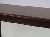 a wooden table with a mirror on top of it
