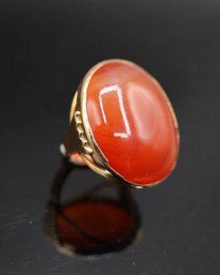 une image représentant une bague sertie d'une pierre de cornaline