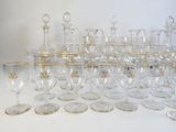a lot of wine glasses that are sitting on a table