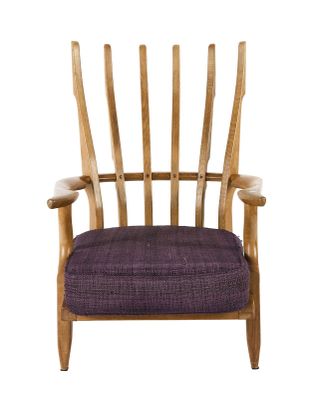 a wooden chair with a purple cushion on it