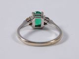 an emerald and diamond ring