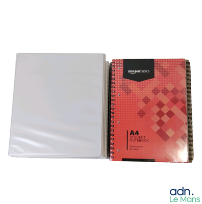 a white notebook with a red cover and a white book