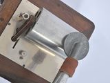 a close up of a metal object on a wooden table