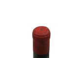 a bottle of wine that is sitting on a table