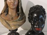 three busts of women on display on a white surface