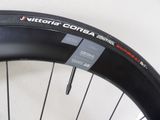 a close up of a bicycle tire on a white surface