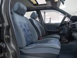 a picture of the inside of a car with blue seats