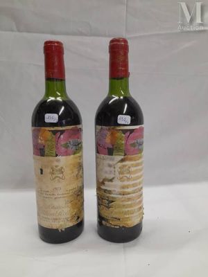 two bottles of wine sitting next to each other on a table