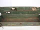 an old green tool box with a metal latch on it