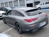 the mercedes cla is parked in a parking lot next to other cars