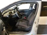 the interior of a car with the door open and the driver ' s seat down