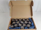 many rolls of tape in a box on a white surface