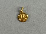 a gold coin with a picture of a woman on it