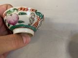 a person holding a cup with a flower design on it