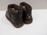 pair of brown ugg boots on a white surface