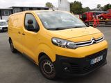 citroen van parked in a parking lot with other vehicles in the background