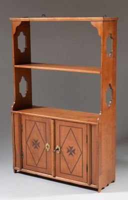 an antique wooden bookcase with two doors and two drawers