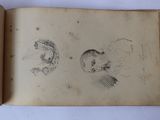 an open book with a drawing of a man and a woman on it