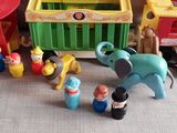 a small toy circus set with a elephant and other toys