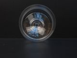 a blurry image of a camera lens on a black surface