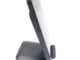a cell phone that is sitting on top of a stand