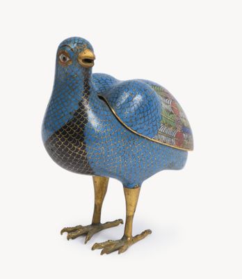 an image of a blue and gold bird figurine on a white background