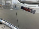a sticker on the door of a silver car