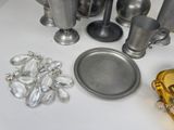 a lot of silver and gold items on the table