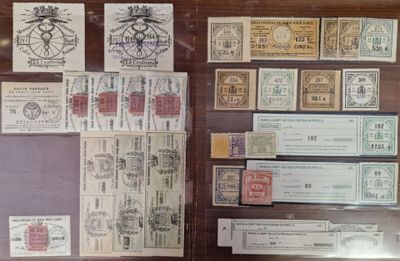 a lot of stamps on display in a glass case