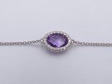 an amethoraite and diamond bracelet on a chain