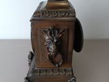 a small metal object with a lion head on it