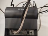 a picture of a printer with a cord attached to it