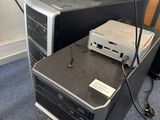 a desktop computer sitting on top of a desk next to a monitor
