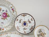many plates that are sitting on a table