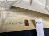 a piece of paper with a wax seal on top of it