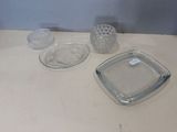 a glass plate and a glass bowl on a table